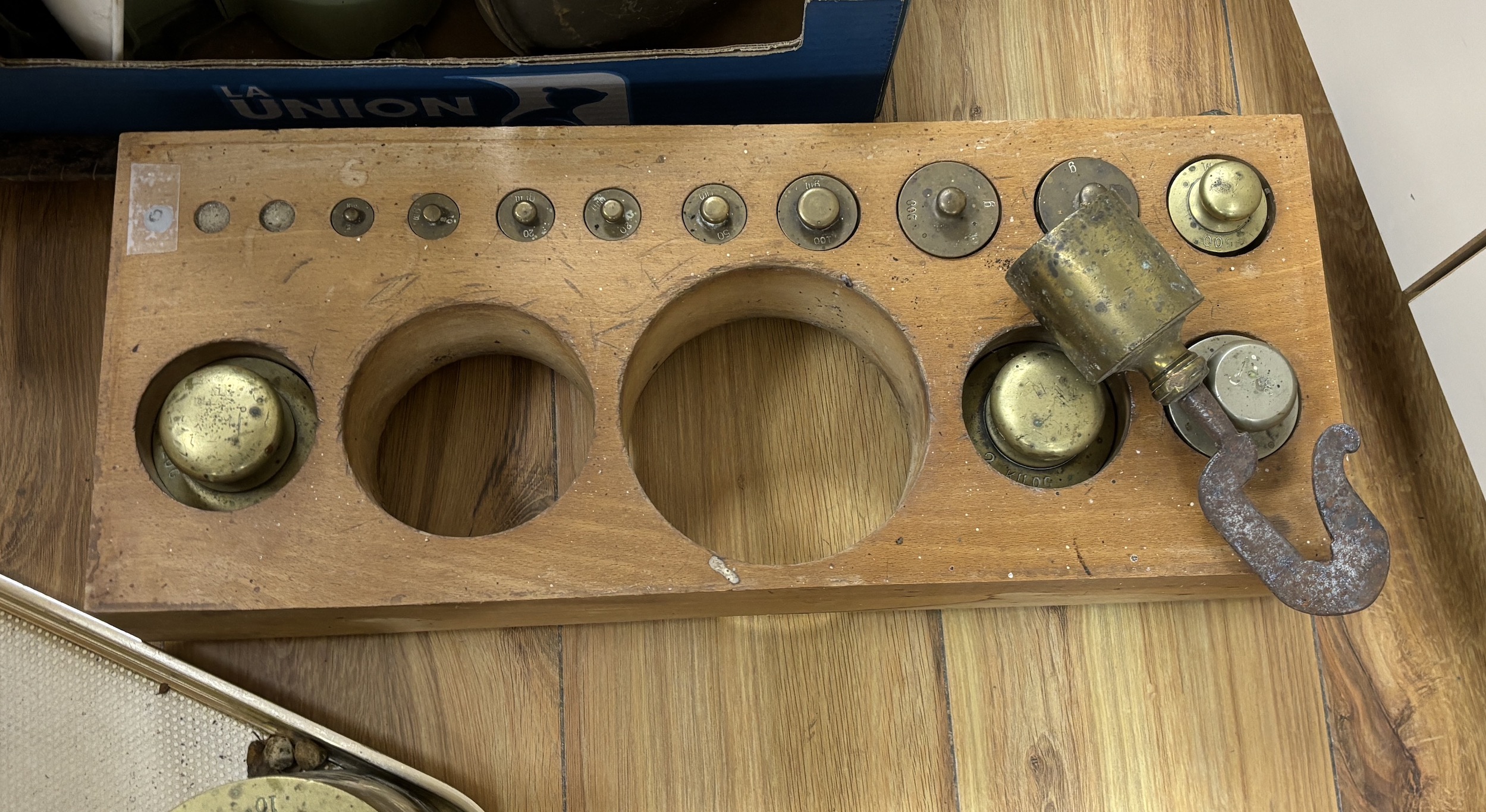 A large graduated part set of weights in wooden stand and other scales and steelyard, wooden base 47cm wide